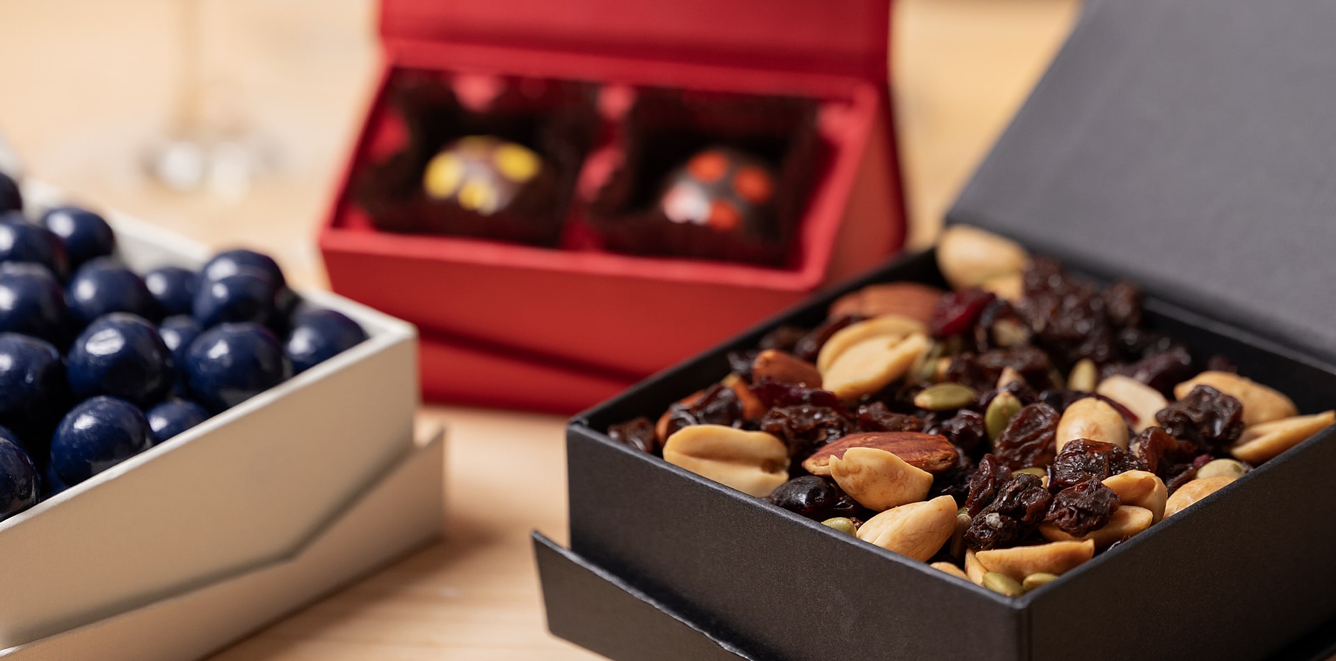 Torn Ranch artisan chocolates and nut assortments arranged as premium in-room hotel amenities.