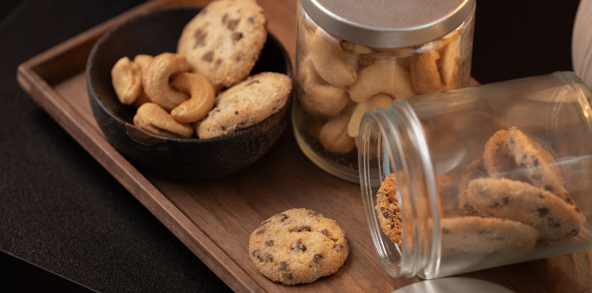 Hotel guest discovering complimentary welcome snacks and water, reflecting the rise of curated minibar lite programs.