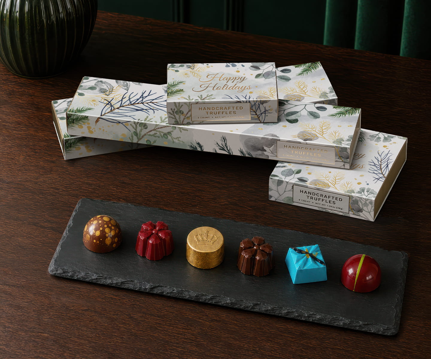 Handcrafted holiday truffles presented as an elegant seasonal welcome amenity in a luxury hotel room